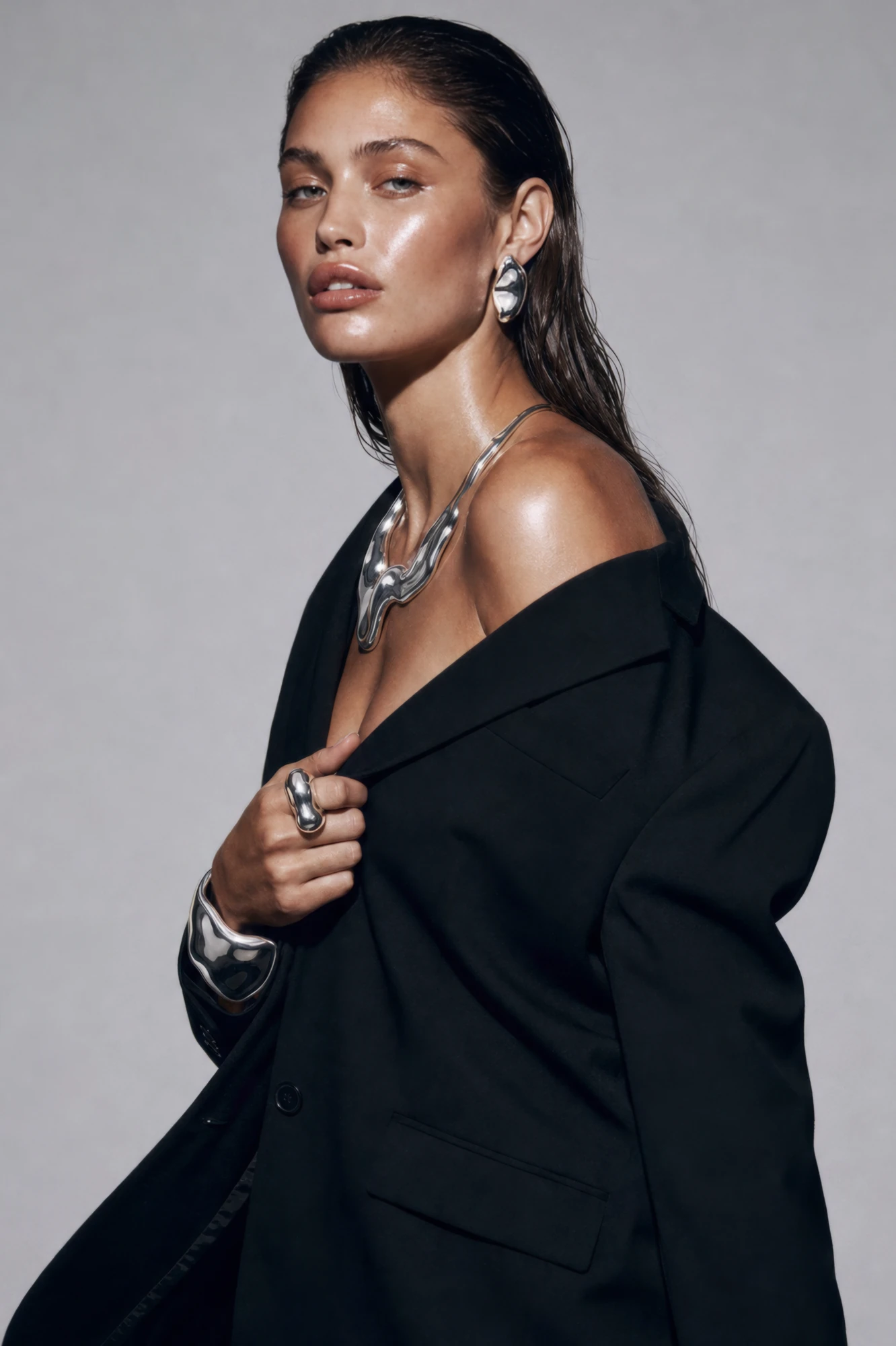 RARE FORM editorial portrait with a sculptural necklace, ring and cuff